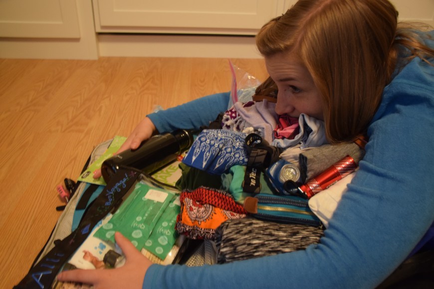 Holding all the precious belonging into the Tortuga, carry-on backpack hoping it will fit