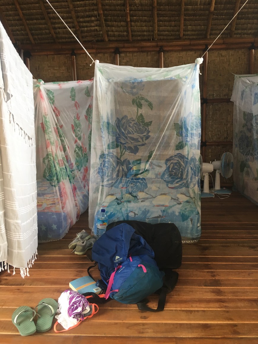 Mosquito nets surrounding twin mattresses in the open air bungalows 