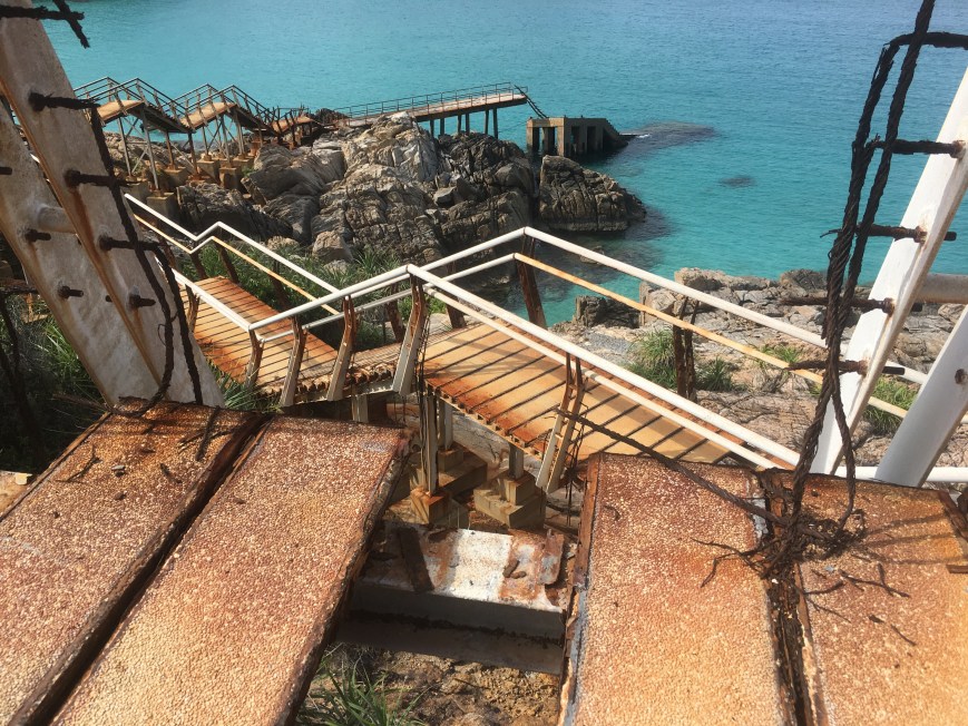 Staircase down to the blue lagoon with its crystal clear water