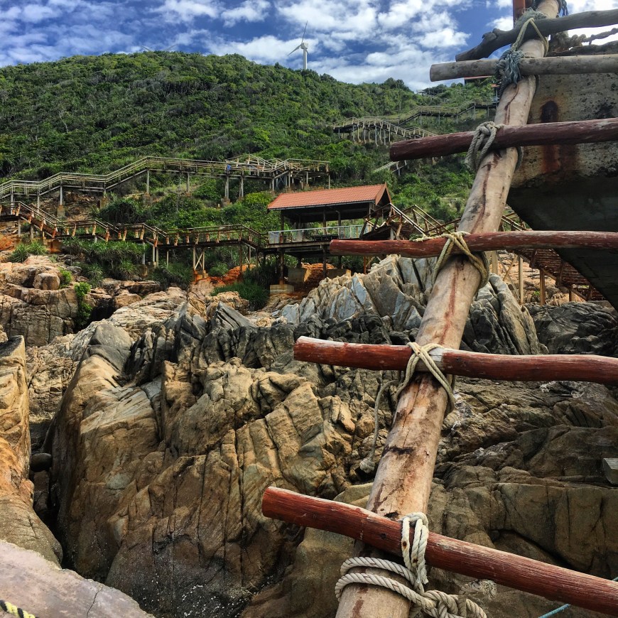 Log ladder connecting the staircase to the broken dock at the blue lagoon