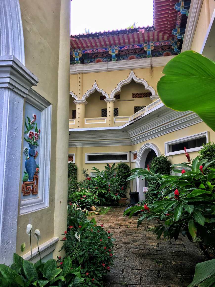 Looking around the side of the Pagoda at Kek Lok Si temple in Penang Malaysia