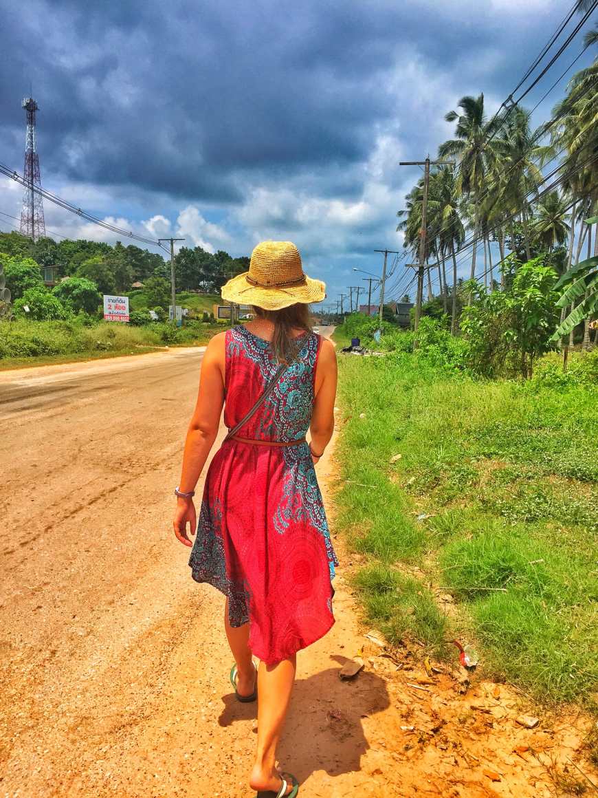 Happily walking down the road in one of the two dresses I brought with me on my travels