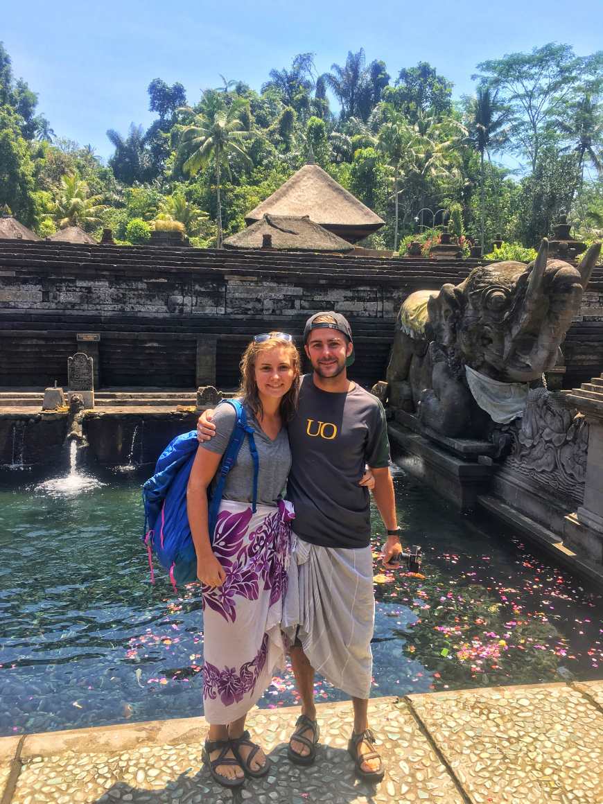 Alli and TJ all smiles after finishing the purification ritual at Tirta Empul