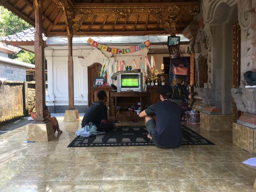 Remy and TJ playing video games on one of the terraces of the family compound