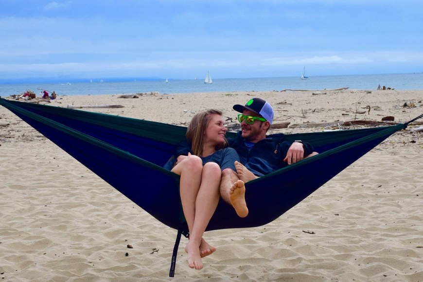 Sitting in our ENO hammock together enjoying the beach