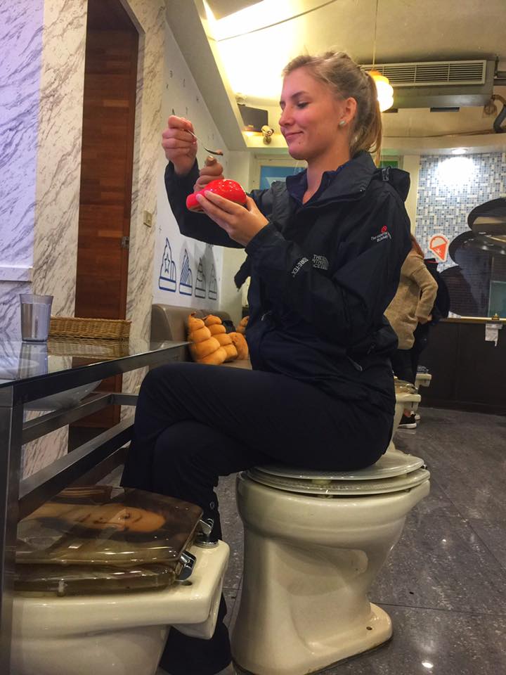 Alli on toilet enjoying her poo ice cream