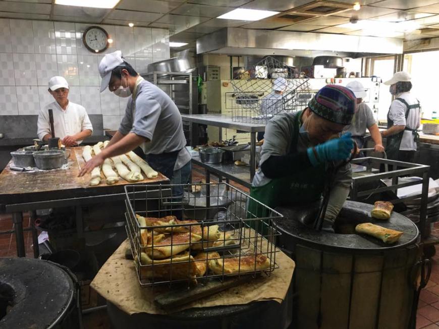 Men in the kitchen hard at work