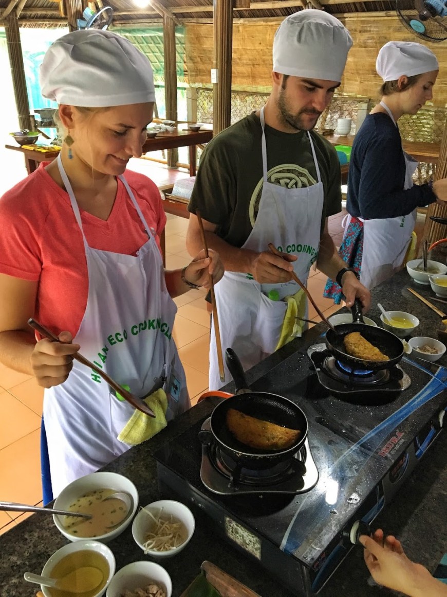 Travel Couple Cooking Banh Xeo At A Cooking Class in Hoi An Vietnam