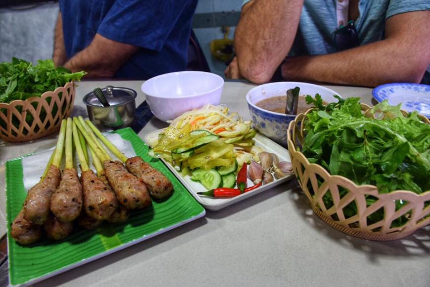 Delicious do-it-yourself vietnamese pork spring rolls over lemongrass