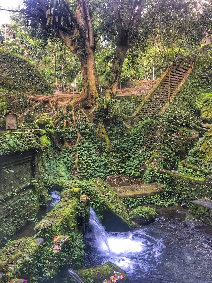 The lush landscape surrounding Pura Mengening and its sacred bathing pools