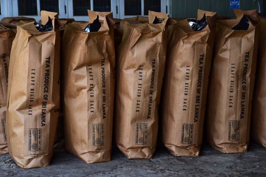 Rows of tea bags set out at Halpe Tea Factory in Sri Lanka after they've been filled with Tea leaves