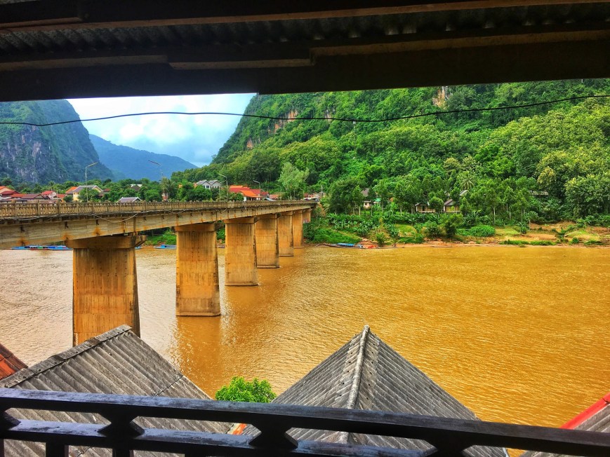 View from balcony of guesthouse overlooking the Nam Ou River and bridge through town in Nong Khiaw Laos